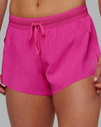 Woman wearing Accelerate 3" Running Short - Ultra Pink | Set:true | Angle:closeup | Model:Keisha | Size:S | Thumbnail Index: 5