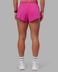 Woman wearing Accelerate 3" Running Short - Ultra Pink | Set:true | Angle:back | Model:Keisha | Size:S | Thumbnail Index: 8