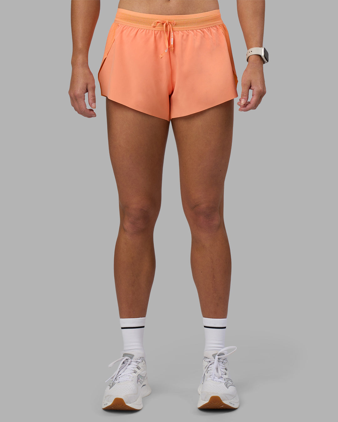 Woman wearing Accelerate 3" Running Short - Cantaloupe | Set:true | Angle:front | Model:Hannah | Size:S - view 1