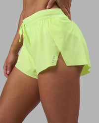 Woman wearing Accelerate 3" Running Short - Lime Glo | Set:true | Angle:closeup | Model:Hannah | Size:S | Thumbnail Index: 8