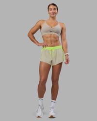 Woman wearing Accelerate 3" Running Short - Lime Glo-Shale Beige | Model:Hannah | Size:S | Thumbnail Index: 9