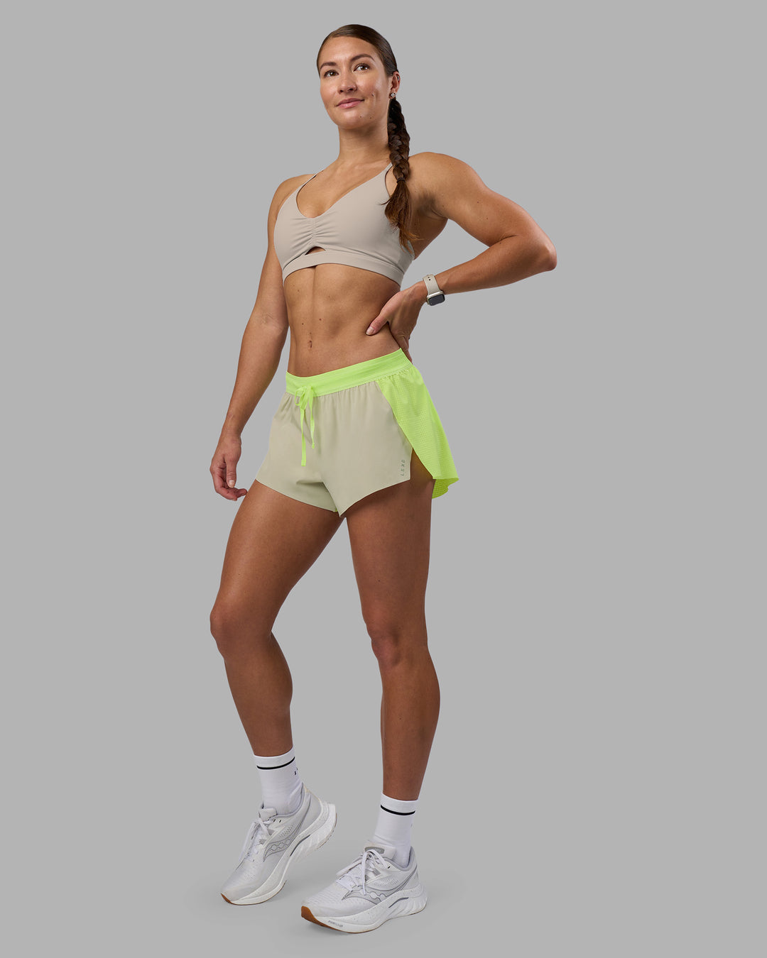 Woman wearing Accelerate 3" Running Short - Lime Glo-Shale Beige | Model:Hannah | Size:S - view 7