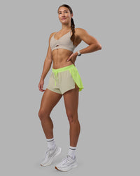 Woman wearing Accelerate 3" Running Short - Lime Glo-Shale Beige | Model:Hannah | Size:S | Thumbnail Index: 6