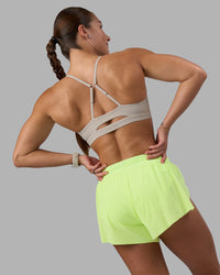 Woman wearing Accelerate 3" Running Short - Lime Glo-Shale Beige | Model:Hannah | Size:S | Thumbnail Index: 8