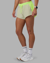 Woman wearing Accelerate 3" Running Short - Lime Glo-Shale Beige | Model:Hannah | Size:S | Thumbnail Index: 7