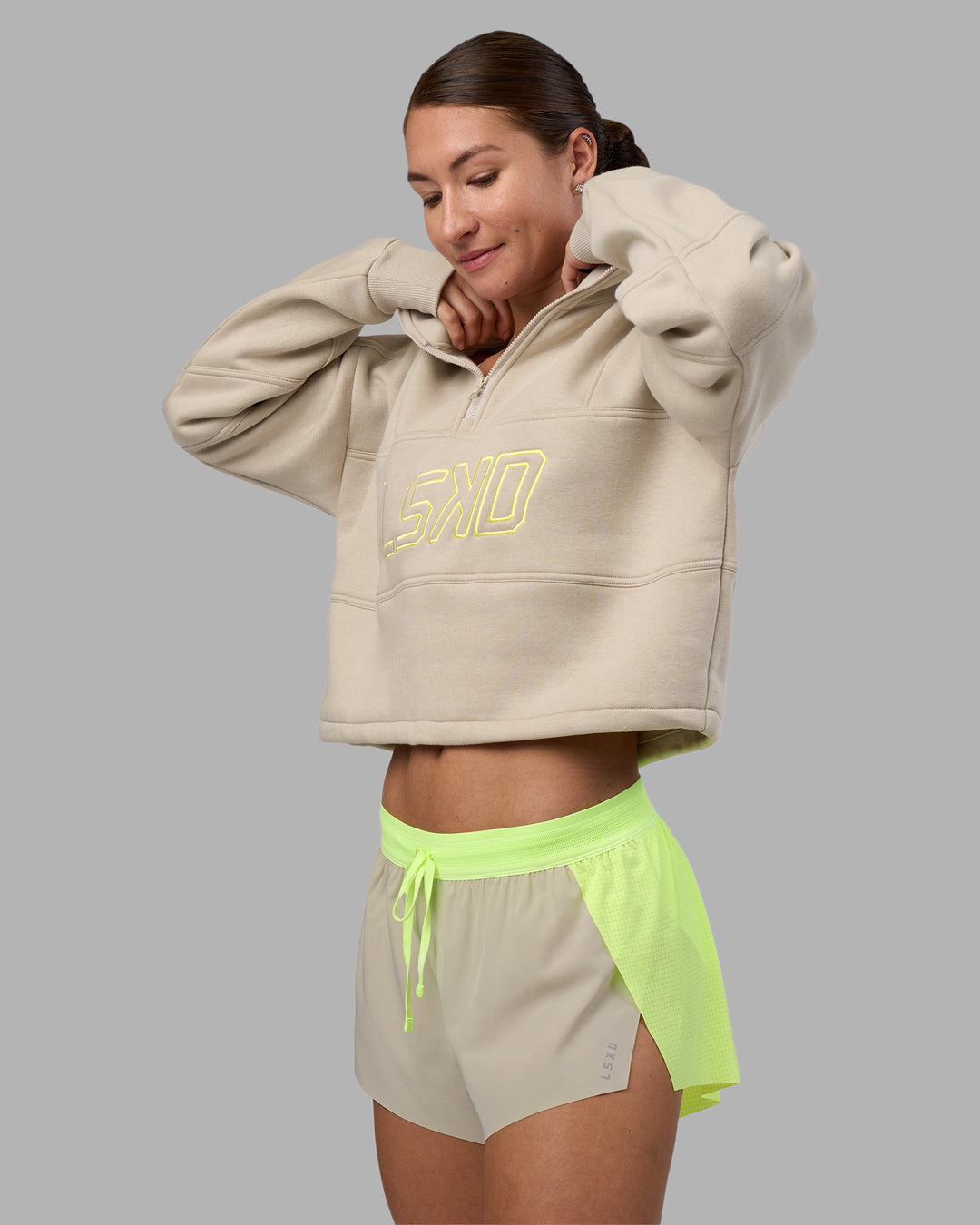 Woman wearing Accelerate 3" Running Short - Lime Glo-Shale Beige | Model:Hannah | Size:S - view 11