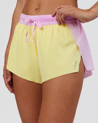 Woman wearing Accelerate 3" Mid-Rise Running Short - Marshmallow-Lemon | Set:true | Angle:closeup | Model:Grace | Size:S | Thumbnail Index: 1