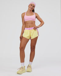 Woman wearing Accelerate 3" Mid-Rise Running Short - Marshmallow-Lemon | Model:Grace | Size:S | Thumbnail Index: 5