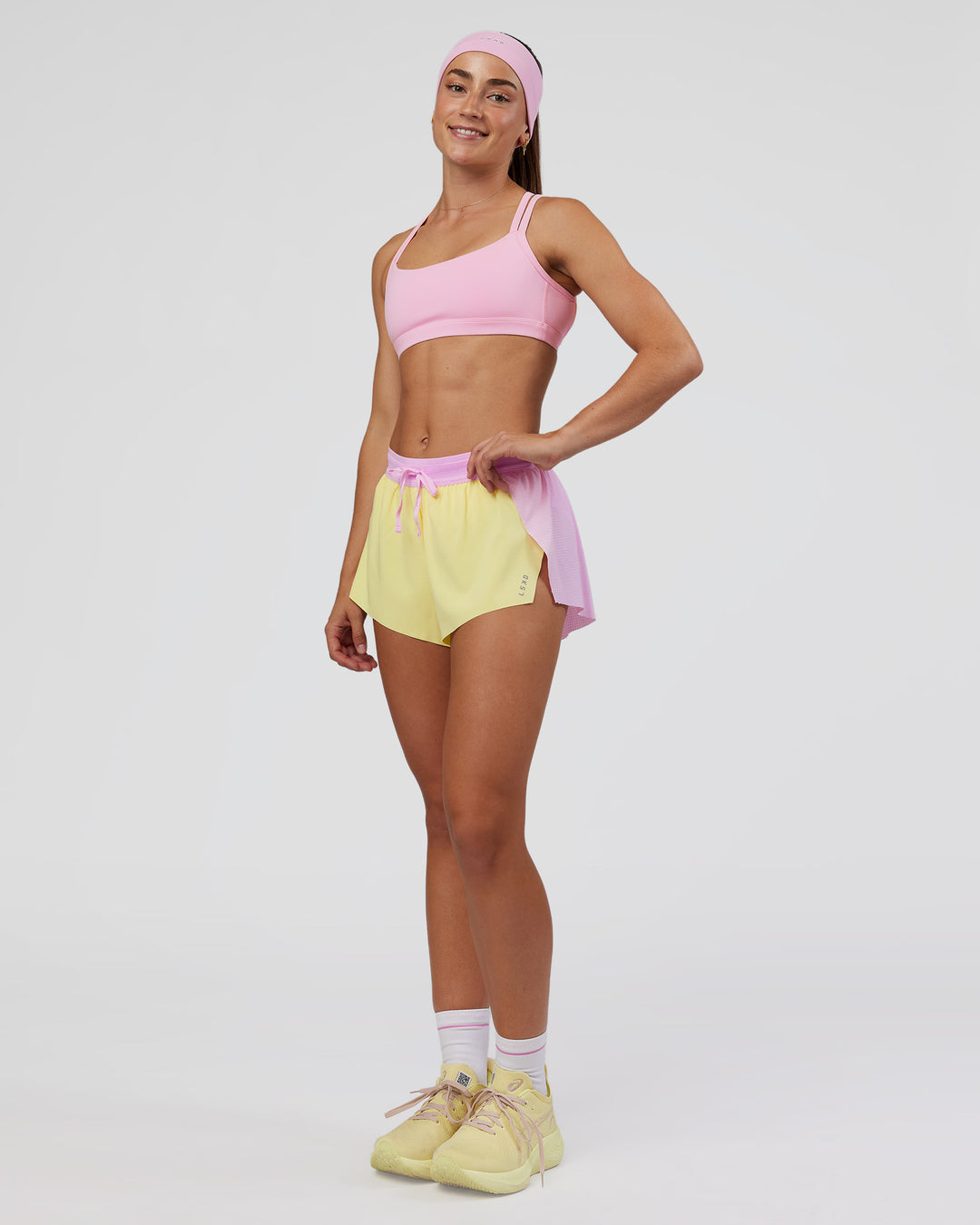 Woman wearing Accelerate 3" Mid-Rise Running Short - Marshmallow-Lemon | Model:Grace | Size:S - view 3