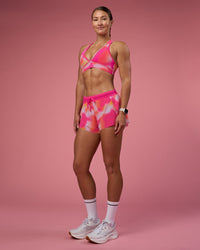 Woman wearing Accelerate 3" Running Short - Pink Glow Print | Model:Hannah | Size:S | Thumbnail Index: 2