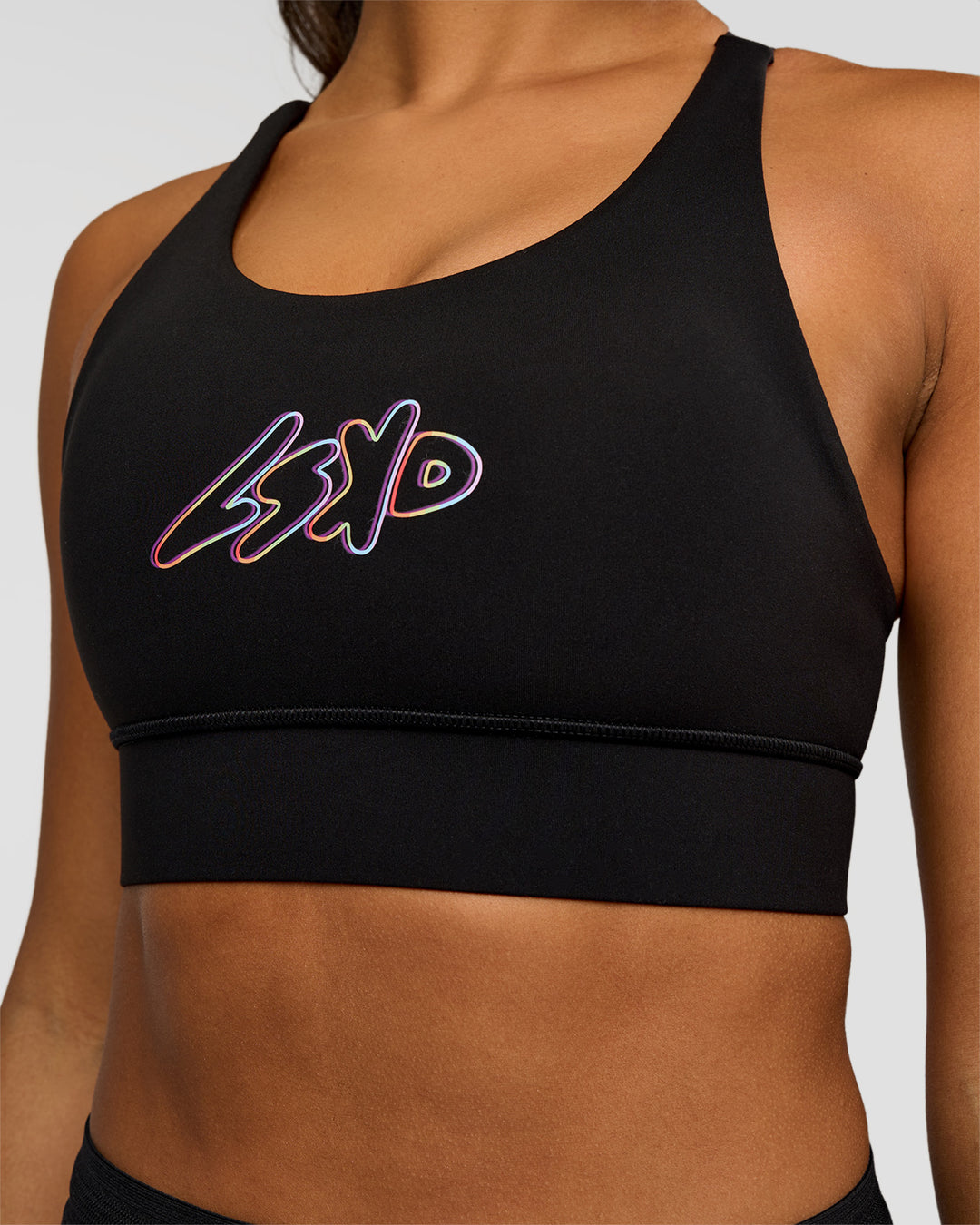 Woman wearing Accelerate Graphic Sports Bra - Black-Radiate | Model:Rosie | Size:S - view 5