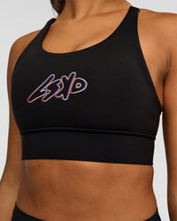 Woman wearing Accelerate Graphic Sports Bra - Black-Radiate | Model:Rosie | Size:S | Thumbnail Index: 4