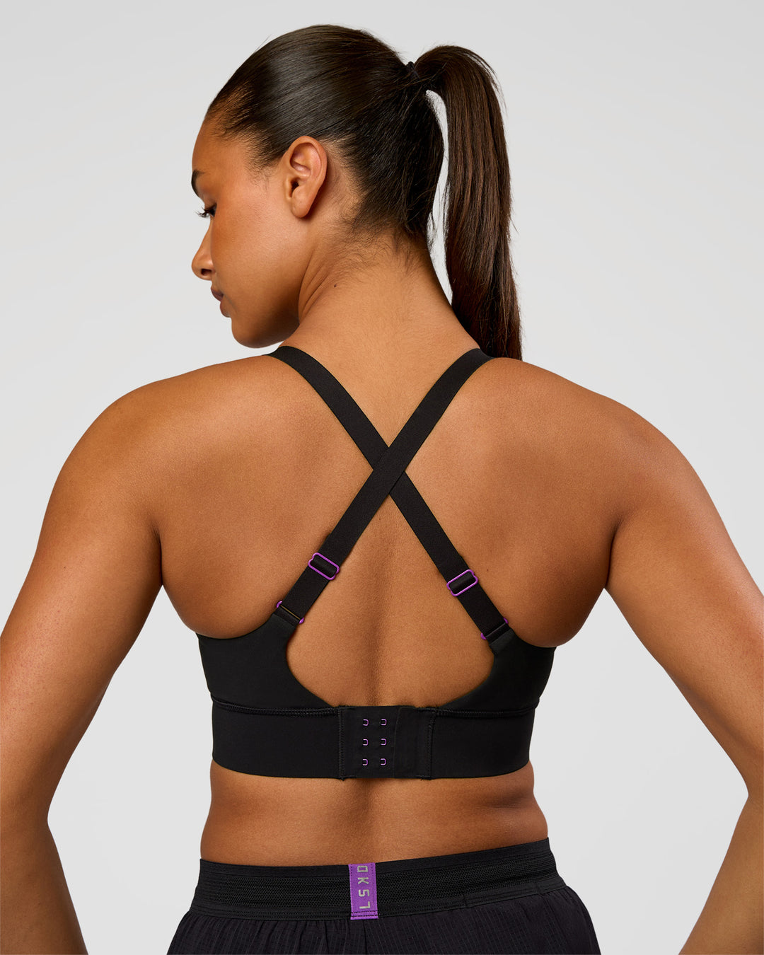 Woman wearing Accelerate Graphic Sports Bra - Black-Radiate | Model:Rosie | Size:S - view 4