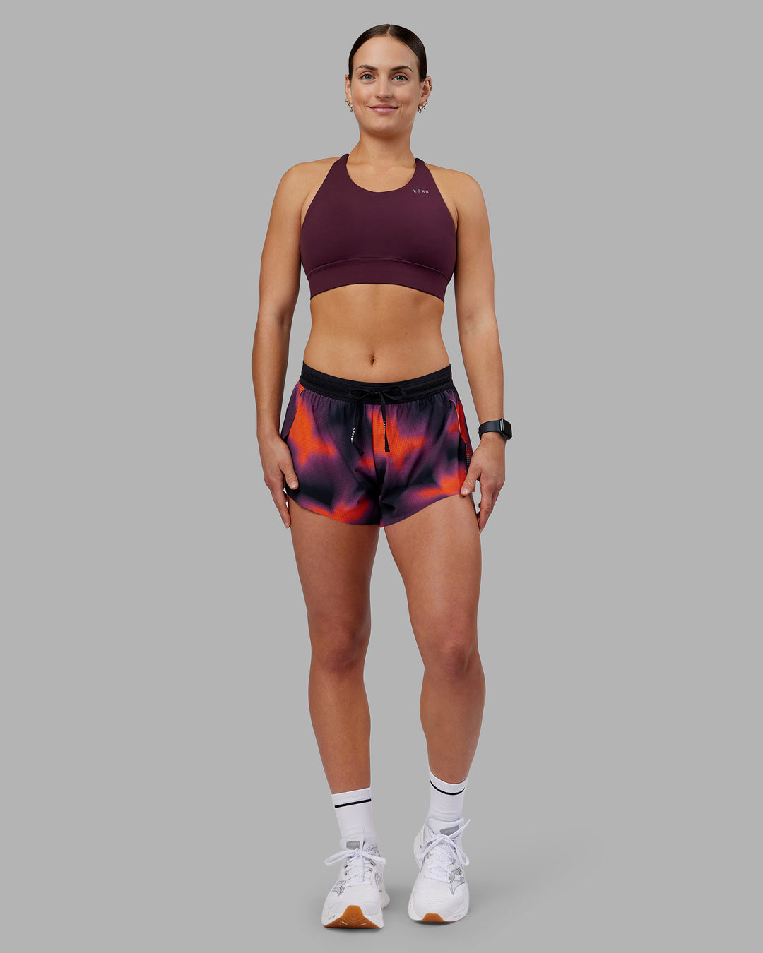 Woman wearing Accelerate Split Strap Sports Bra - Cherry Lacquer | Model:Keisha | Size:S - view 4