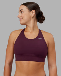 Woman wearing Accelerate Split Strap Sports Bra - Cherry Lacquer | Model:Keisha | Size:S | Thumbnail Index: 0