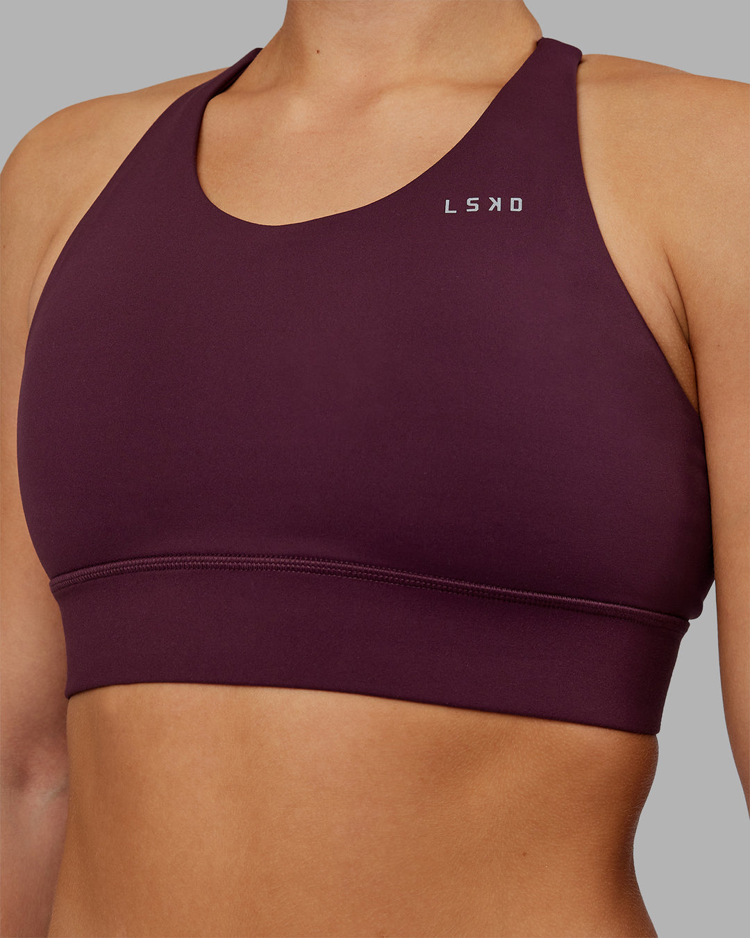 Woman wearing Accelerate Split Strap Sports Bra - Cherry Lacquer | Model:Keisha | Size:S - view 5