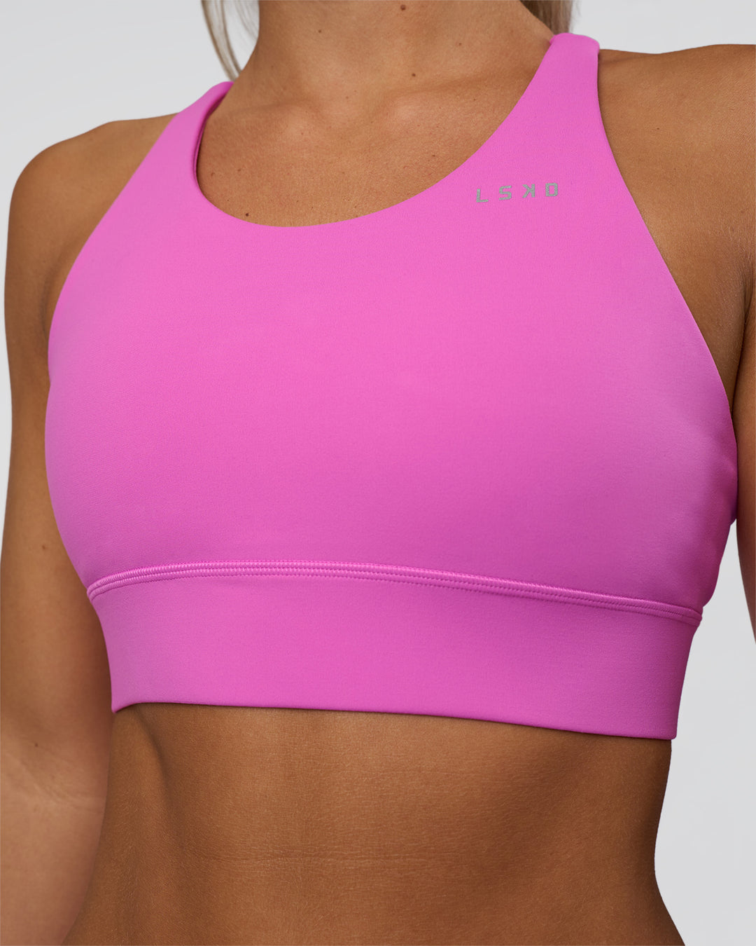 Woman wearing Accelerate Split Strap Sports Bra - Ultra Fuchsia | Model:Amity | Size:S - view 4