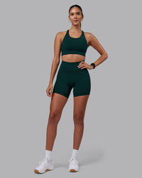 Woman wearing Accelerate Sports Bra - Dark Moss | Model:Rhiley | Size:S | Thumbnail Index: 2