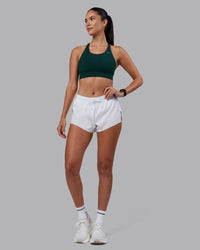 Woman wearing Accelerate Sports Bra - Dark Moss | Model:Rhiley | Size:S | Thumbnail Index: 6