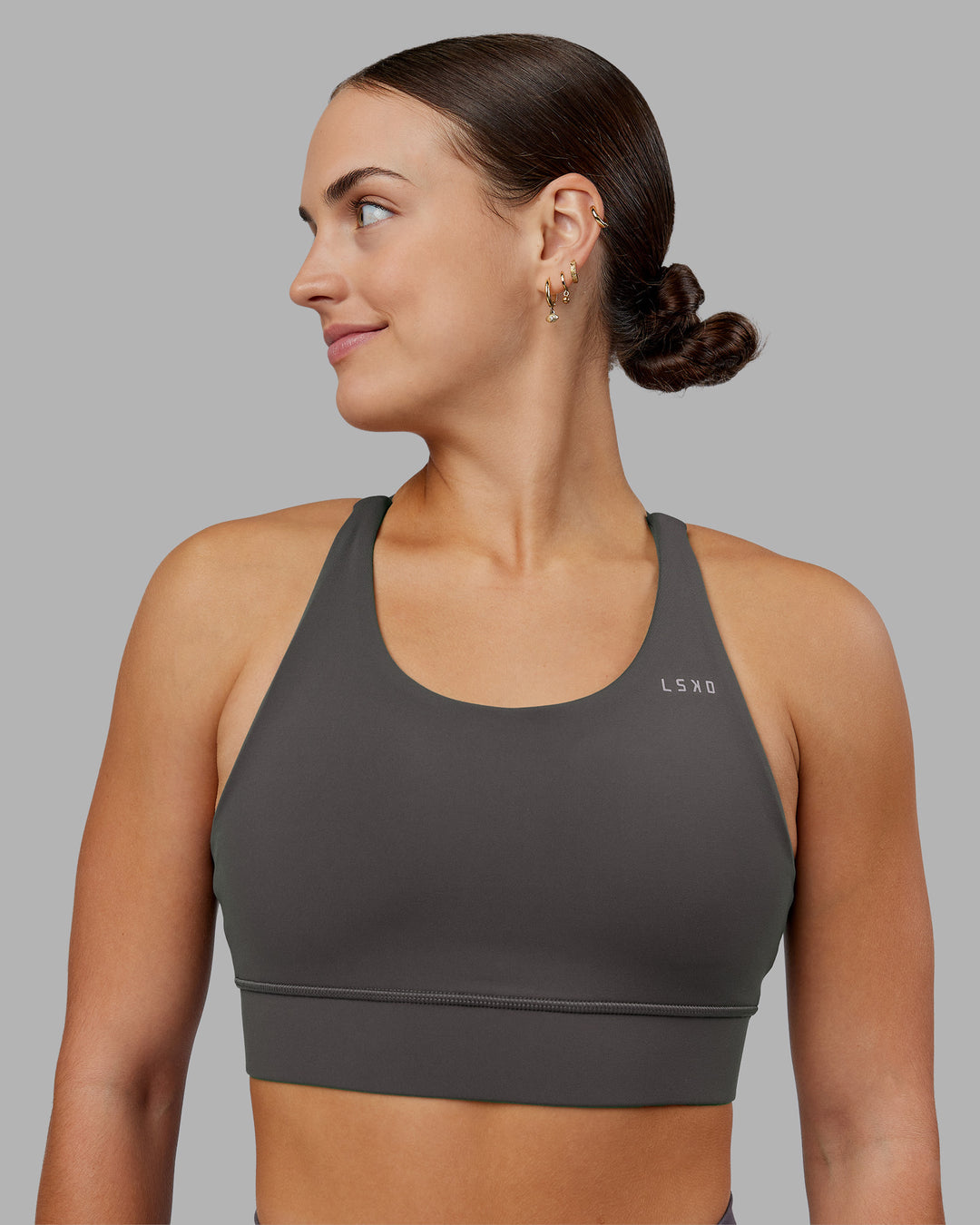 Woman wearing Accelerate Sports Bra - Dark Storm | Model:Keisha | Size:S - view 1