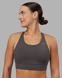 Woman wearing Accelerate Sports Bra - Dark Storm | Model:Keisha | Size:S | Thumbnail Index: 0