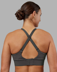 Woman wearing Accelerate Sports Bra - Dark Storm | Model:Keisha | Size:S | Thumbnail Index: 1