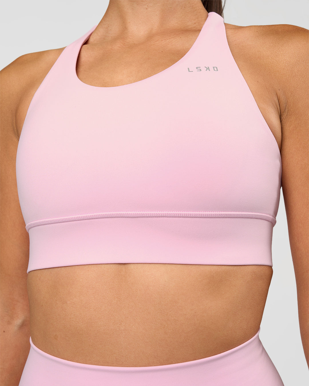 Woman wearing Accelerate Sports Bra - Marshmallow | Set:true | Angle:closeup | Model:Rhiley | Size:S - view 4