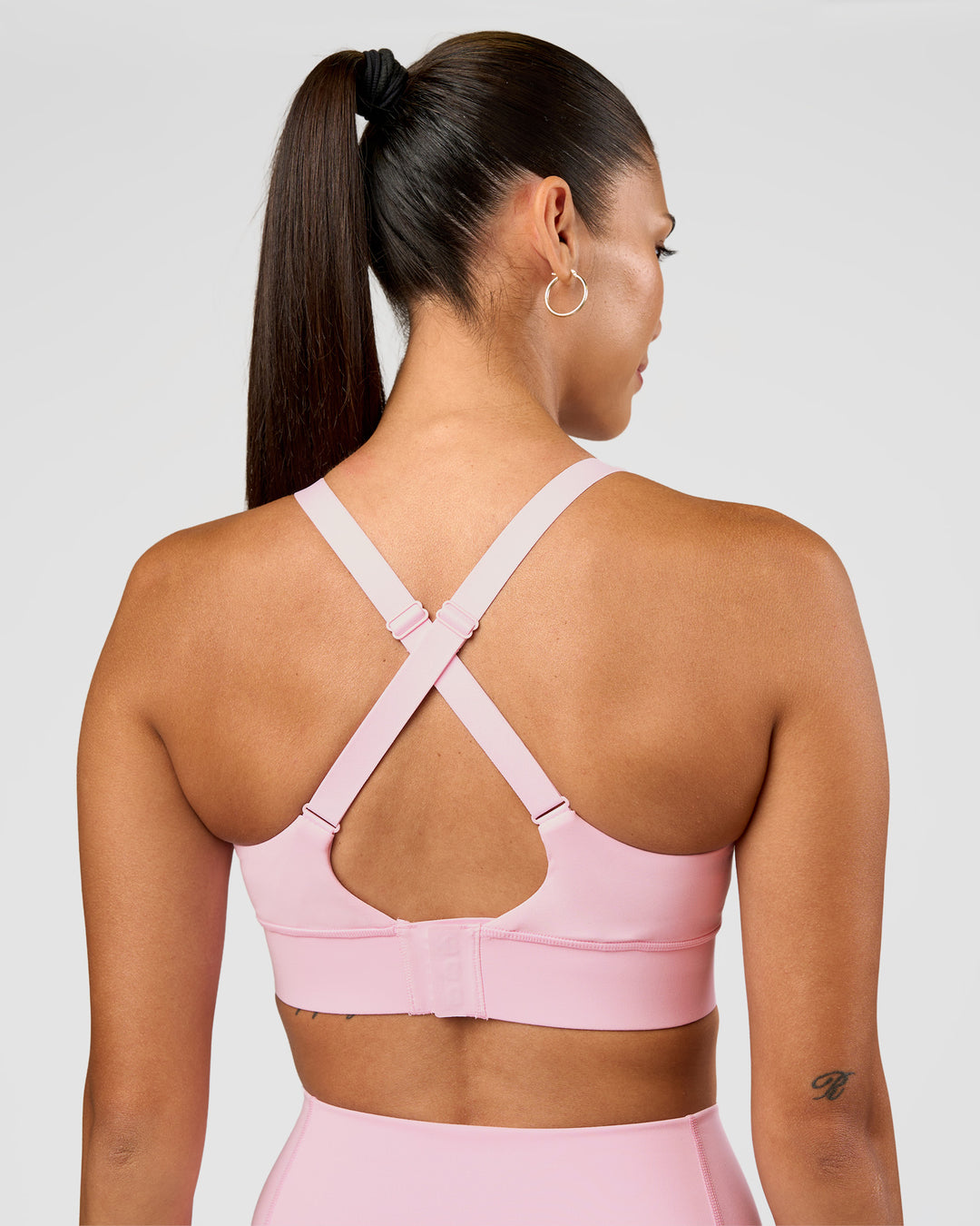 Woman wearing Accelerate Sports Bra - Marshmallow | Set:true | Angle:back | Model:Rhiley | Size:S - view 2