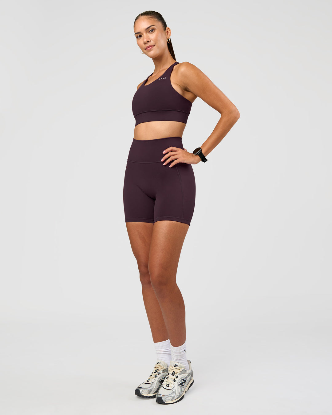 Woman wearing Accelerate Sports Bra - Midnight Plum | Model:Rhiley | Size:S - view 5