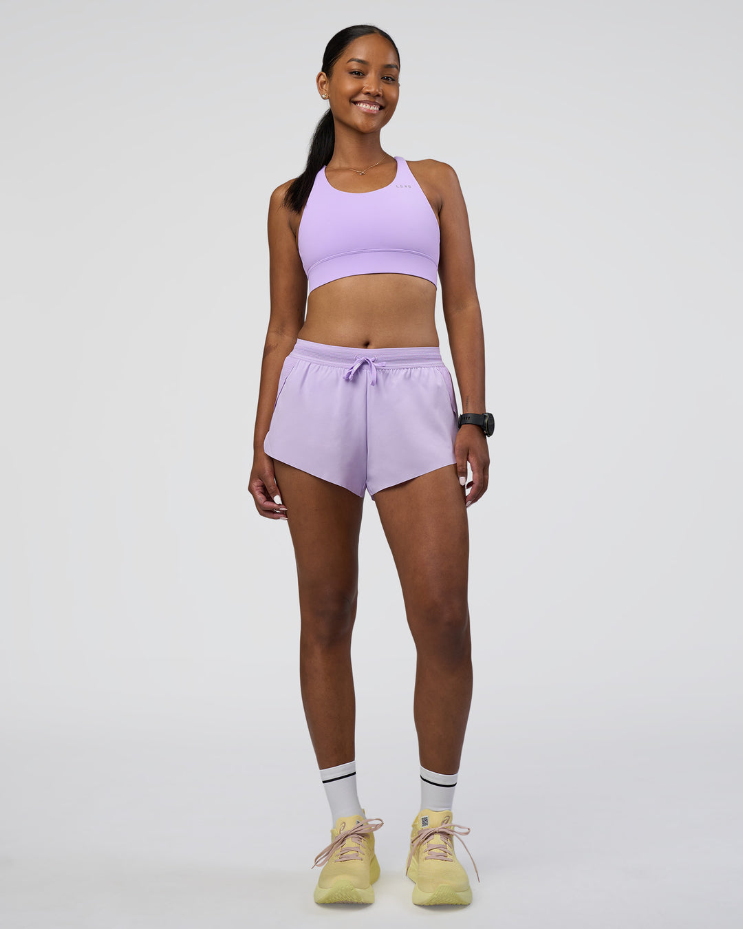Woman wearing Accelerate Sports Bra - Pale Lilac | Model:Rica | Size:S - view 6