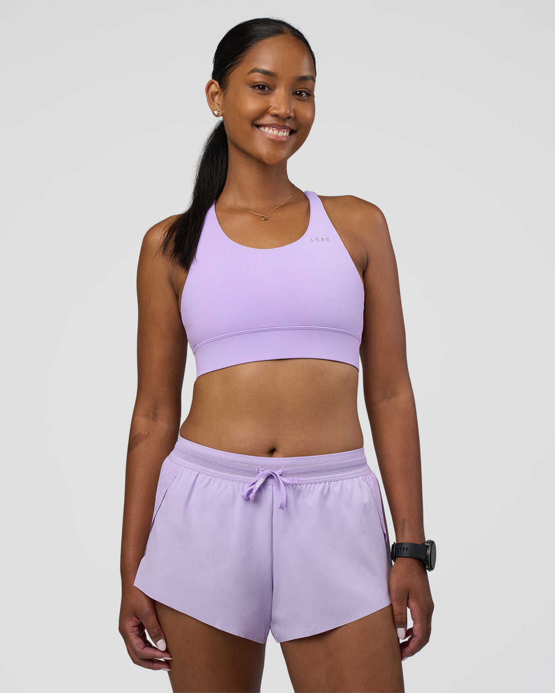 Woman wearing Accelerate Sports Bra - Pale Lilac | Model:Rica | Size:S - view 4