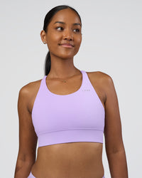 Woman wearing Accelerate Sports Bra - Pale Lilac | Set:true | Angle:front | Model:Rica | Size:S | Thumbnail Index: 0