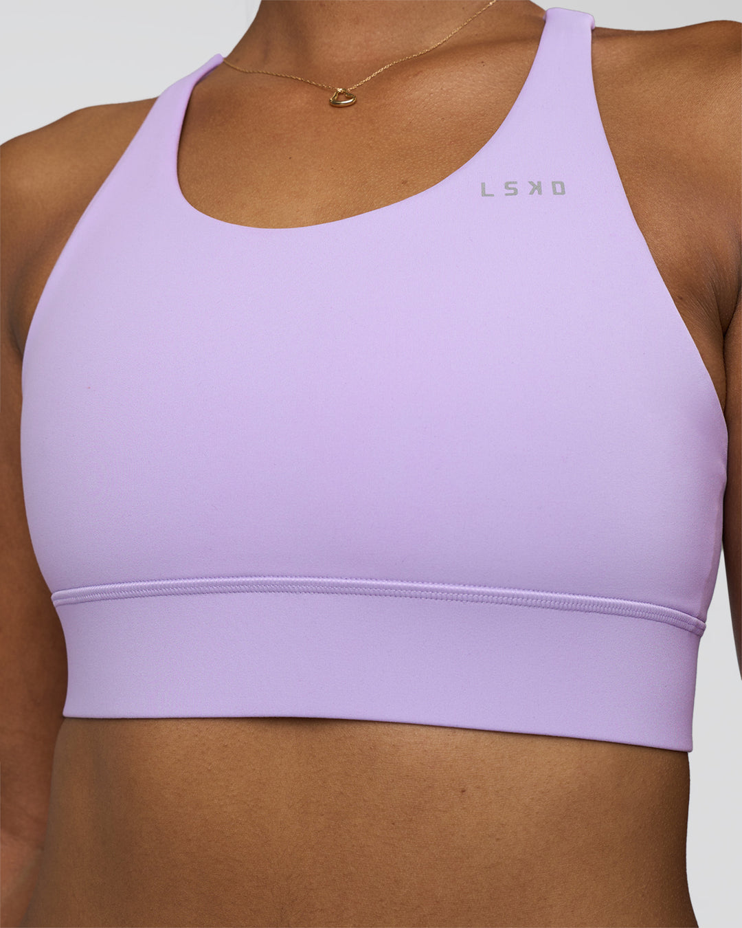 Woman wearing Accelerate Sports Bra - Pale Lilac | Set:true | Angle:closeup | Model:Rica | Size:S - view 3