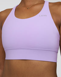 Woman wearing Accelerate Sports Bra - Pale Lilac | Set:true | Angle:closeup | Model:Rica | Size:S | Thumbnail Index: 2