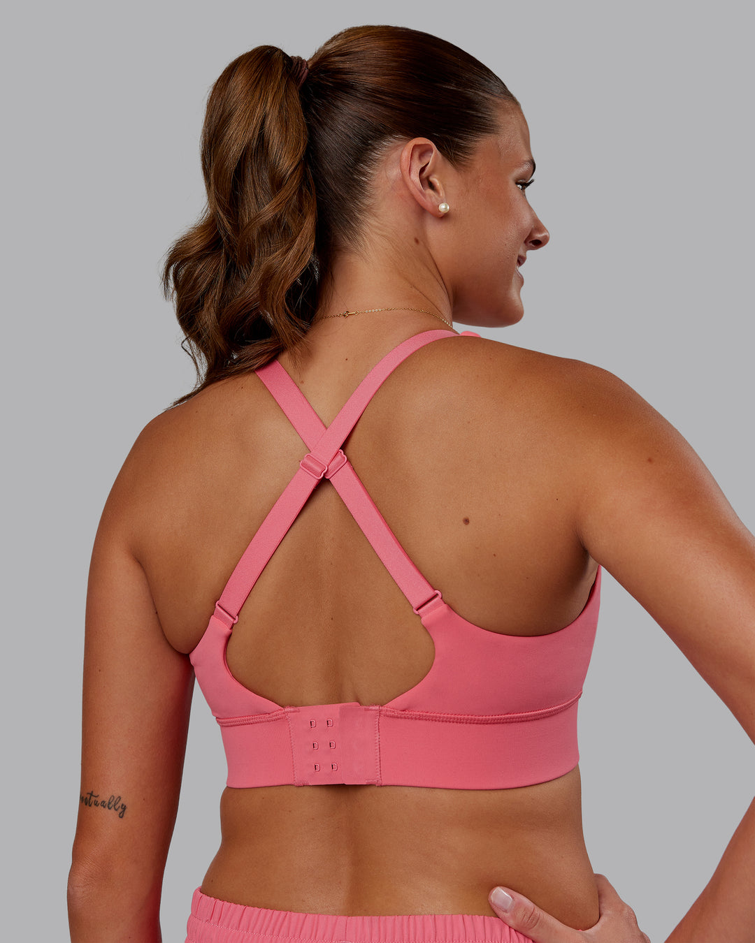 Woman wearing Accelerate Sports Bra - Pink Lemonade | Model:Phoebe | Size:S - view 2