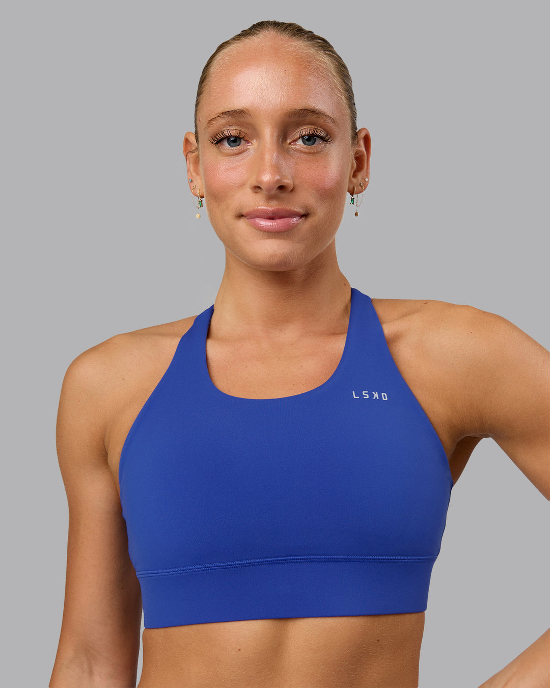 Woman wearing Accelerate Sports Bra in Power Cobalt | Size:S - view 1