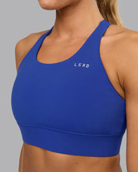 Woman wearing Accelerate Sports Bra in Power Cobalt | Size:S | Thumbnail Index: 7
