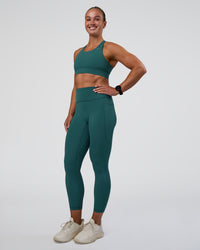 Woman wearing Accelerate Sports Bra - Transformative Teal | Model:Sav | Size:S | Thumbnail Index: 2