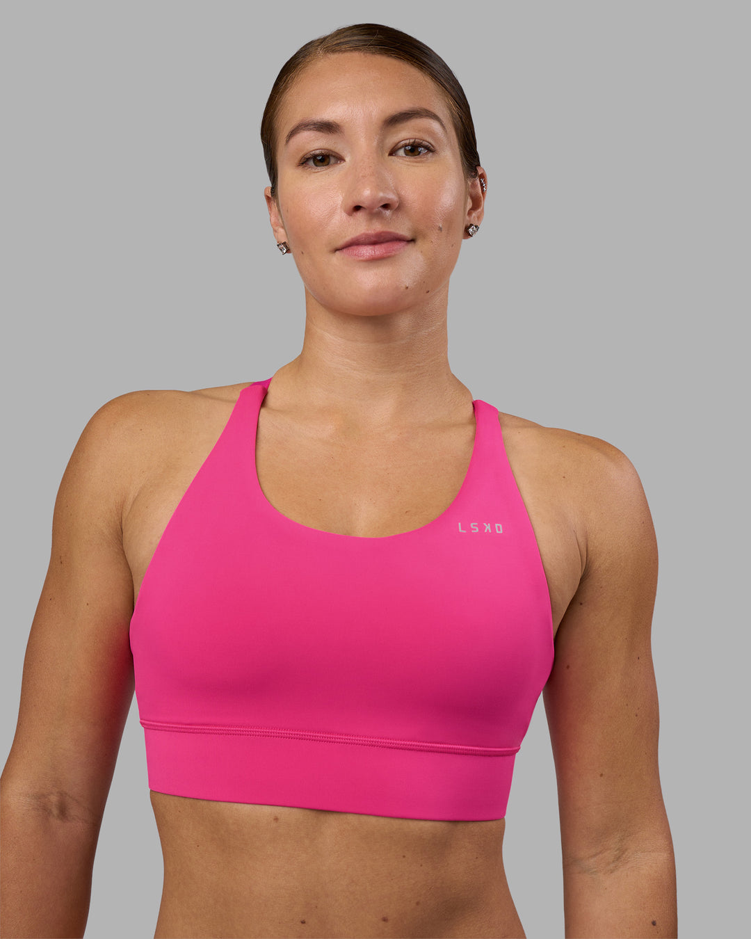 Woman wearing Accelerate Sports Bra - Ultra Pink | Model:Hannah | Size:S - view 1