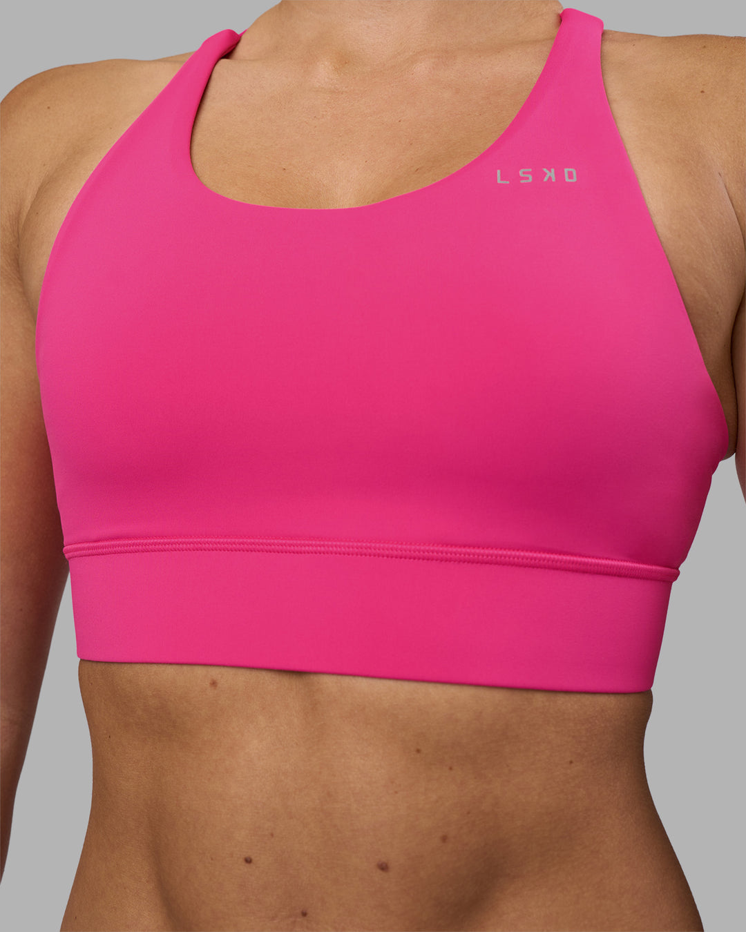Woman wearing Accelerate Sports Bra - Ultra Pink | Model:Hannah | Size:S - view 4