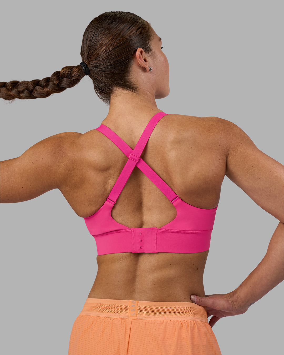 Woman wearing Accelerate Sports Bra - Ultra Pink | Model:Hannah | Size:S - view 2