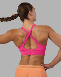 Woman wearing Accelerate Sports Bra - Ultra Pink | Model:Hannah | Size:S | Thumbnail Index: 1