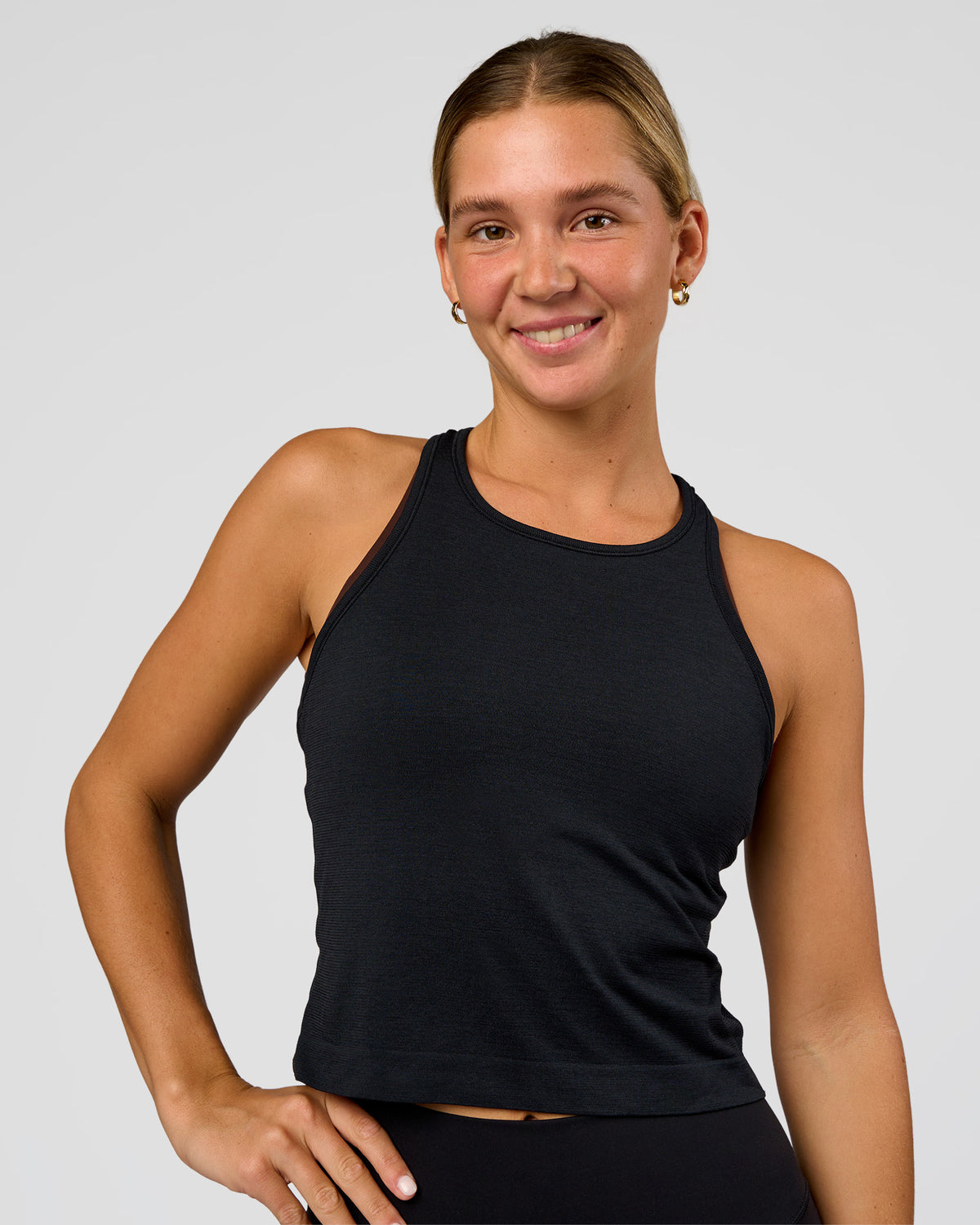 Woman wearing AeroFLX+ Seamless Flow Skimmer Tank - Black Marl | Model:Amity | Size:S