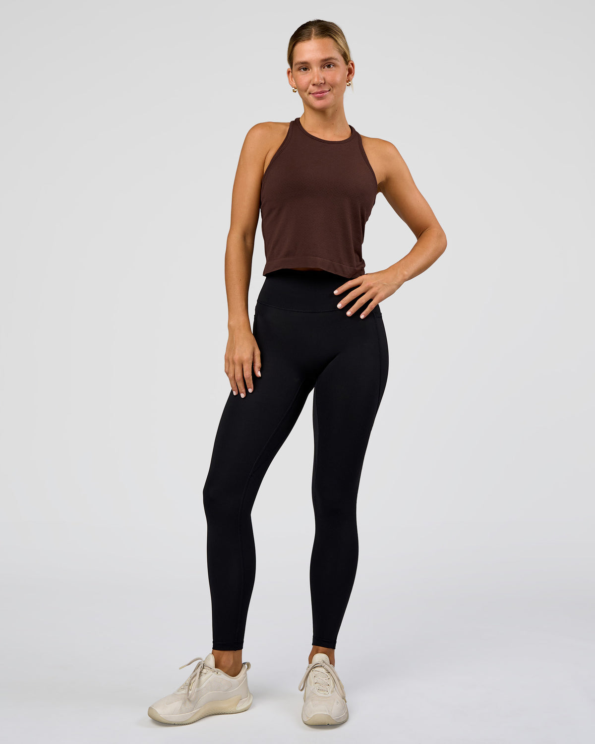 Woman wearing AeroFLX+ Seamless Flow Skimmer Tank - Hot Chocolate/Hot Chocolate | Model:Amity | Size:S