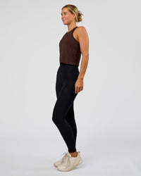 Woman wearing AeroFLX+ Seamless Flow Skimmer Tank - Hot Chocolate/Hot Chocolate | Model:Amity | Size:S | Thumbnail Index: 2
