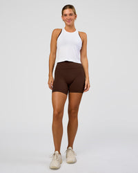 Woman wearing AeroFLX+ Seamless Flow Skimmer Tank - White/White | Model:Amity | Size:S | Thumbnail Index: 1