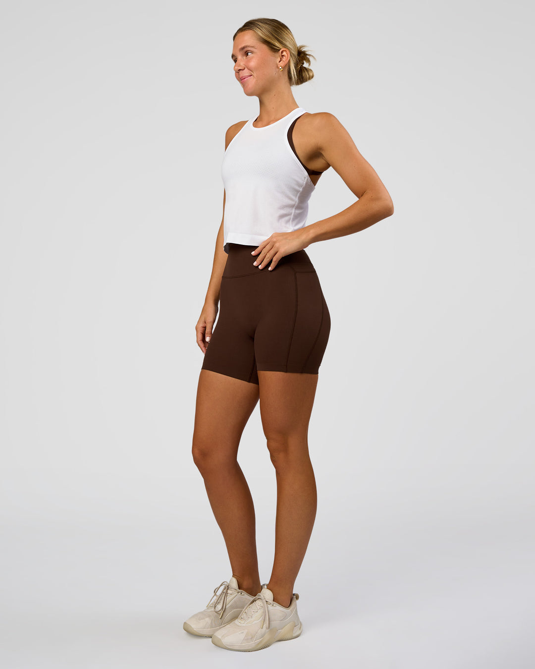 Woman wearing AeroFLX+ Seamless Flow Skimmer Tank - White/White | Model:Amity | Size:S - view 5