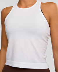 Woman wearing AeroFLX+ Seamless Flow Skimmer Tank - White/White | Model:Amity | Size:S | Thumbnail Index: 2