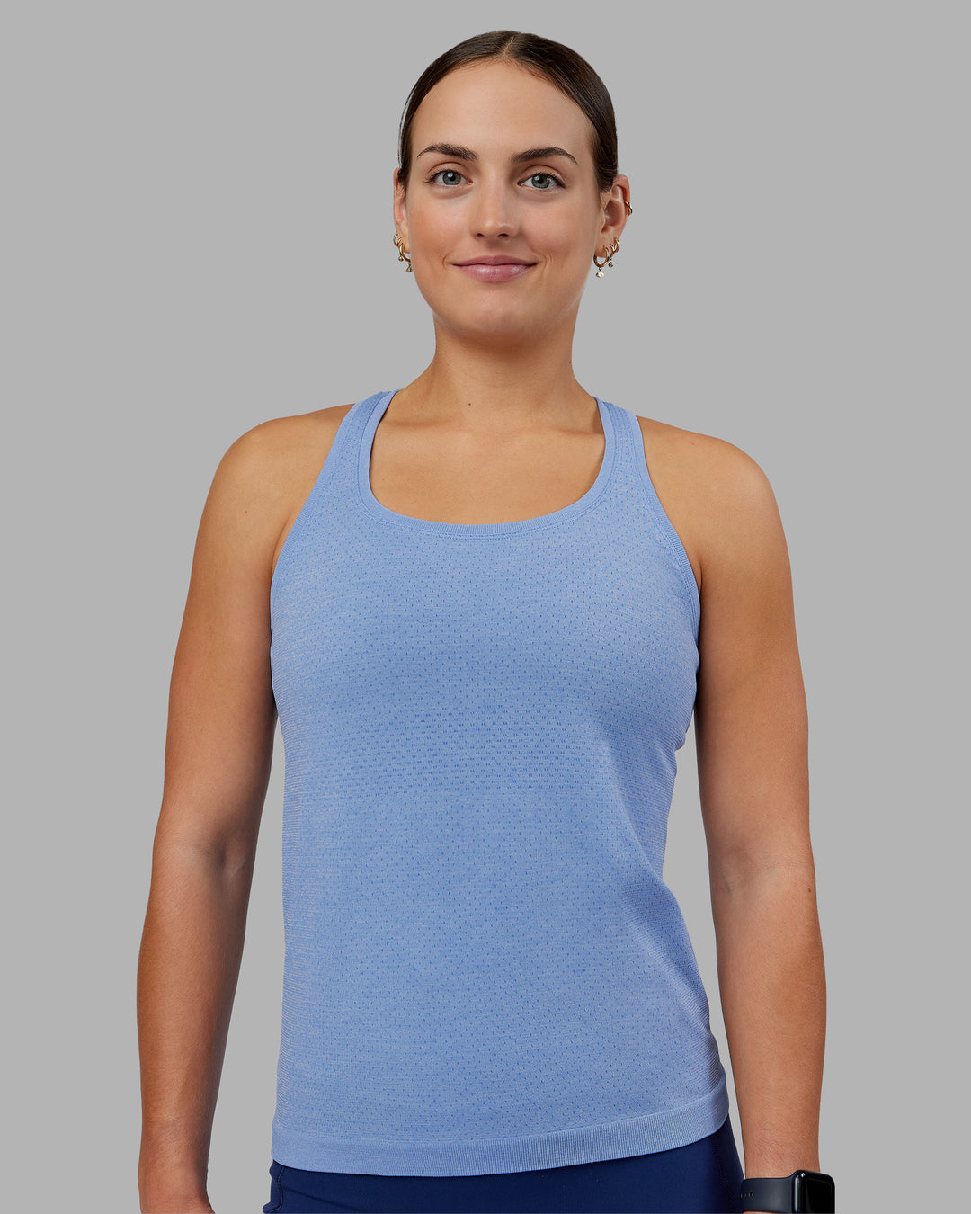 Woman wearing AeroFLX+ Seamless Tank - Cornflower Blue Marl | Model:Keisha | Size:S - view 3