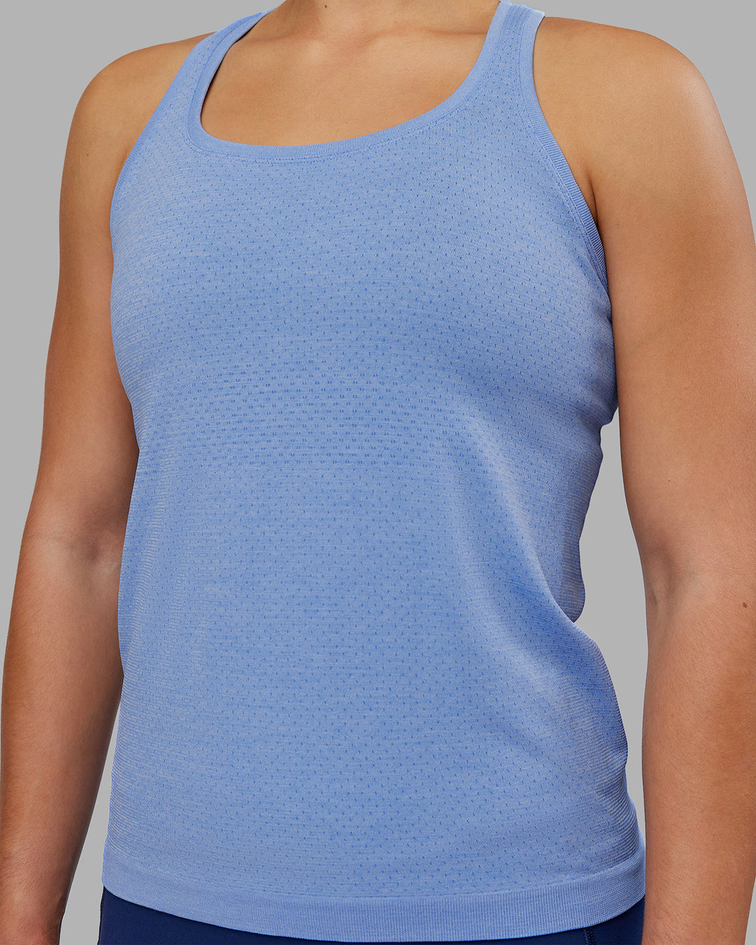 Woman wearing AeroFLX+ Seamless Tank - Cornflower Blue Marl | Model:Keisha | Size:S - view 6